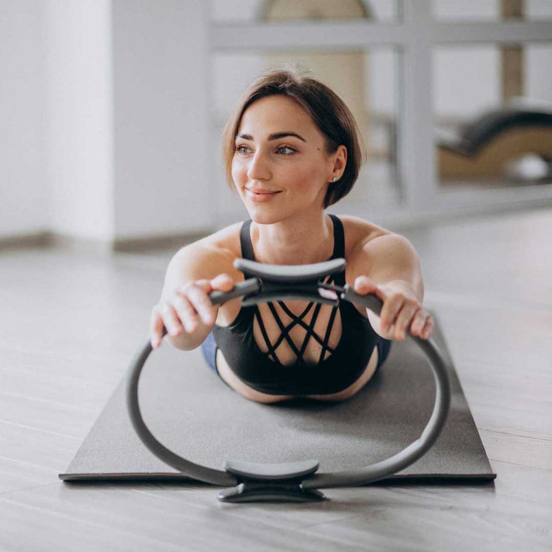 Mat Pilates class with a Pilates ring at Pure Motion