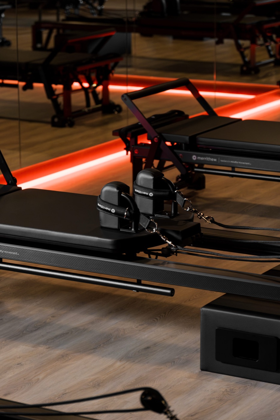 Reformer Pilates class on Merrithew machines in the Pure Motion studio