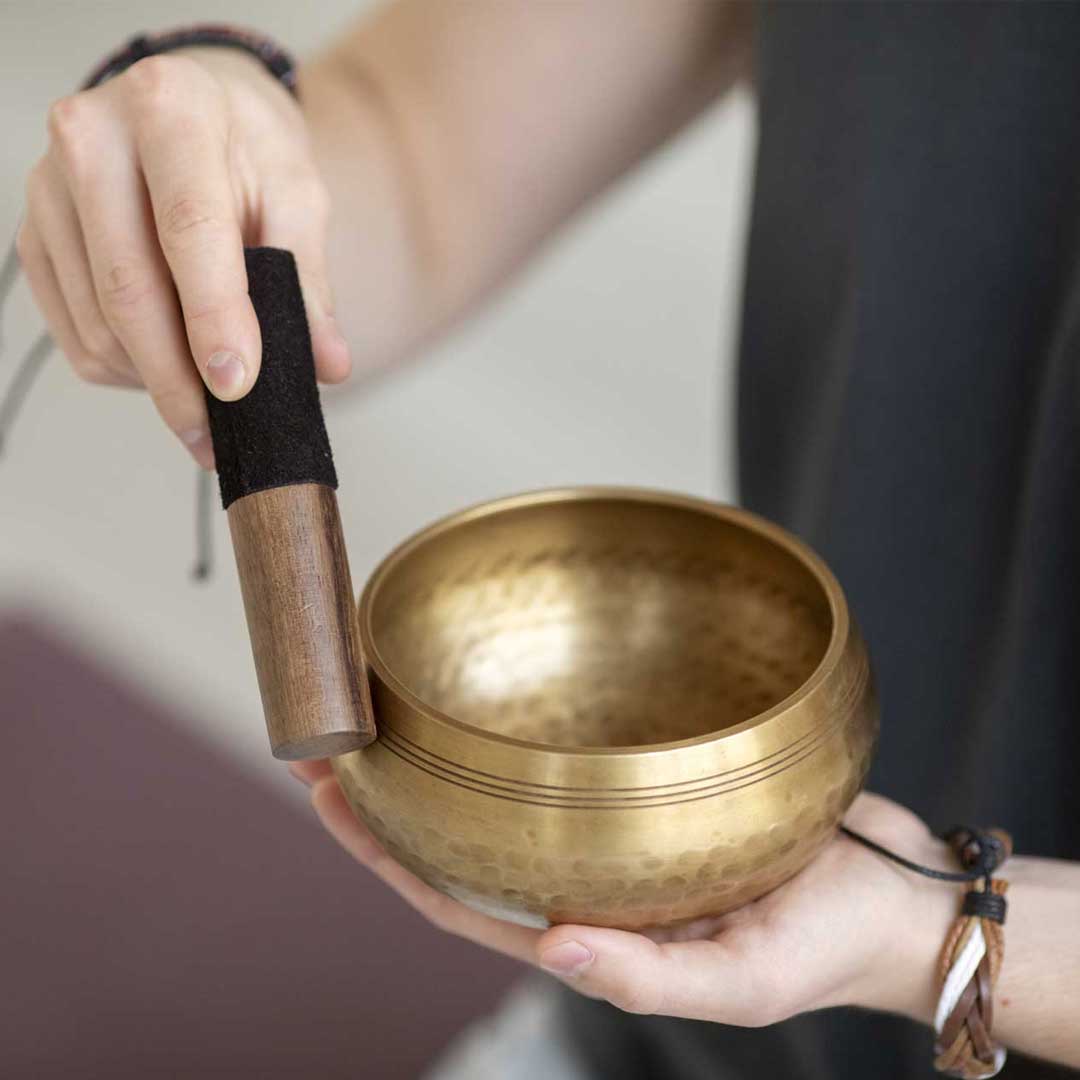 Sound healing bowl during a wellness session at Pure Motion